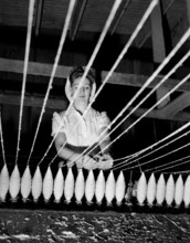 A worker watches an early industrial plastic manufacturing process in a California factory, ca. 1946.