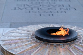 Paris, France - June 25, 2023 : View of the eternal flame at the tomb of the unknown soldier at the Arc de Triomphe in Paris France