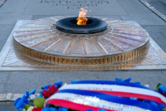Paris, France - June 25, 2023 : View of the eternal flame at the tomb of the unknown soldier at the Arc de Triomphe in Paris France