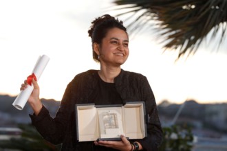 CANNES, FRANCE - MAY 25: Payal Kapadia poses with the Grand Prix Award for 'All We Imagine As Light' during the Palme D'Or Winners Photocall at the 77th annual Cannes Film Festival at Palais des Festi...
