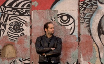Jan 19, 2006; Mexico City, MEXICO; Mexican film maker, CARLOS REYGADAS' work is quintessentially Mexico City, here photographed in front of a decomposing mural on the streets of the historical center ...