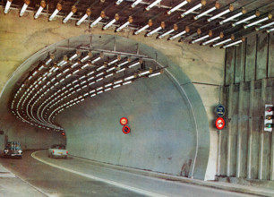 A postcard image of the Mont Blanc tunnel which runs 11.8km between France and Italy. At the time of opening in July 1965 it was three times longer than any rival tunnel. Original publisher: Couleurs ...