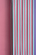 vertical pink green purple striped concrete or cement wall architecture abstract background