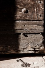 Historical key near a wooden door