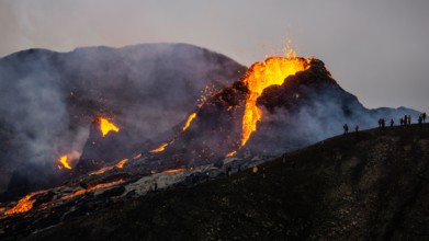 Molten lava flowing from a small volcanic eruption in Mt Fagradalsfjall, near the capital of Reykjavik, Southwest Iceland, in March 2021.