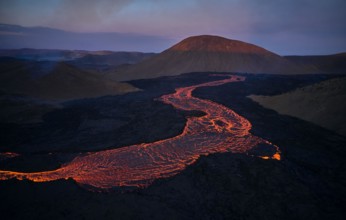 Flowing lava in volcanic mountains