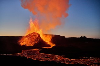 Hot lava erupting from volcanic mountain