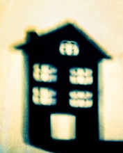 Shadow of a house on a wall