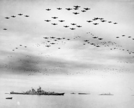 Massed formations of Vought F4U Corsair and Grumman F6F Hellcat planes fly over Tokyo Bay during the surrender ceremonies on the 2nd September 1945. The battleship USS Missouri, on which the surrender...
