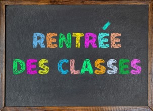School slate with inscription "Rentrée des classes" in French