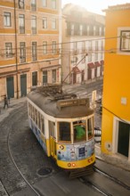 Old tram on the cobbled street in Lisbon, Portugal