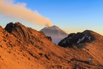 Evening on the slope of Iztaccihuatl volcano viewing the smoking Popocatepetl, Mexico