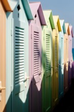 Group of colorful beach cabins in Italy.