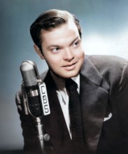 Portrait photograph of Orson Welles, promoting the premiere broadcast of Orson Welles and his Mercury Theater (Orson Welles Show) September 15, 1941, on CBS Radio - colorized photo