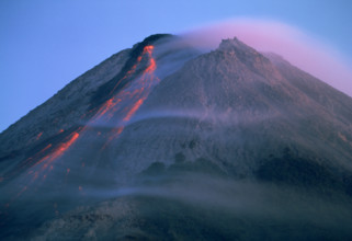 Eruption of Gunung Merapi, a highly active volcano near Yogyakarta, Java, Indonesia, Southeast Asia