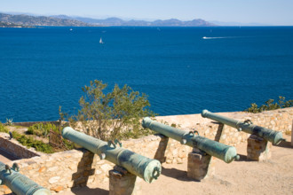 The historic cannons of the citadel of Saint-Tropez are situated above the bay of Saint-Tropez at the Cote d'Azur / Provence
