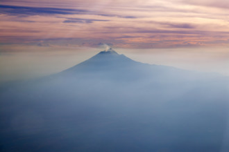 Popocatepetl volcano in Mexico DF city aerial view from aircraft