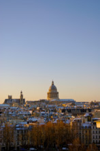The Pantheon in Paris with morning lights under snow.