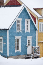 Quaint traditional architecture wooden buildings along Storgata in city of Tromso, in the Arctic Circle in Northern Norway