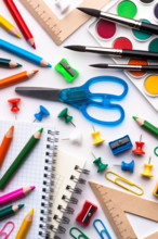 Assortment of various school items, white background