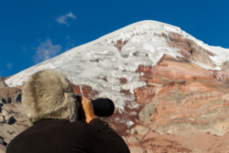 Mountain Tracker Studying The Peak Of Chimborazo Volcano For Avalanches With A Huge Binocular Alpaca Hat