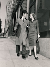 Couple walking on city street
