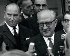 Sep. 09, 1951 - General Secretary of French Section of the Workers' International (SFIO) Guy Mollet is pictured being interviewed by journalists. Mr. Leenhart, who is on the left, is President of the ...