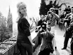 Actress Brigitte Bardot surrounded by paparazzi
