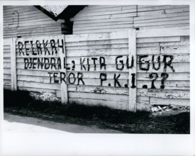 Oct. 10, 1965 - Indonesia: Djakarta - fence in city after aborted communist coup of Oct. 1, 1965, says that communist party is traitor to the Indonesian revolution and charges terror tactics. These si...