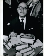 Nov. 11, 1965 - Jacques Borel: Winner of the Goncourt Literary Prize for his book ''Adoration'' -signing his book. (He is English teacher in a Paris school)