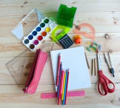 bunch of school supplies are on the table