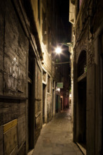 Venice, Italy. narrow street or 'calle' at night