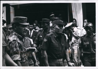 1965 - General Abdul Haris Nasuton, Centre, griefstricken, as he leaves his house in Djakarta for funeral of his 5-year-old daughter who was fatally wounded in the aborted communist coup of Oct 1, 196...