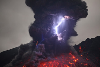 Japan, Kagoshima area - Sakurajima eruption with lightning. TRAVELLING a million-miles around the planet this photographer has completed his quest to show the alien side to the Earth. From celestial a...