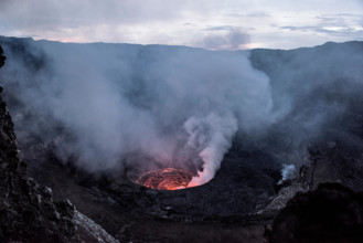 Crater of nyiragongo volcano in eruption