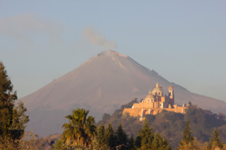 Cholula, church on the pyramid and Popocatepetl, Mexico