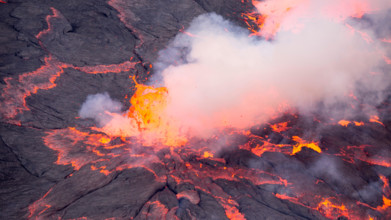 Lava bursts out of the worlds largest lava lake inside Nyiragongo in the Democratic Republic of Congo.  Taken 500 metres inside the active volcano.