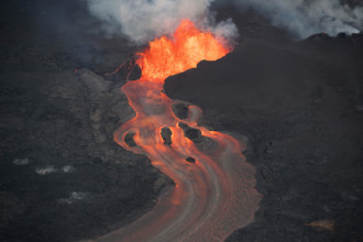aerial view of lava from Kilauea Volcano, erupting from fissure 8 in Leilani Estates, near Pahoa, sending a river of lava to Kapoho, Hawaii, USA