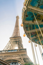 View of the famous Eiffel Tower and carousel in the foreground, Paris, France