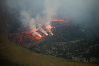 An active lava lake churns in the crater of Mount Nyiragongo Volcano, Kibati, Virunga National Park, Democratic Republic of Congo (DRC).