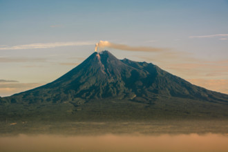 beauty of sunrise merapi mountain, indonesia. Mount Merapi is one of the most active mountains in Indonesia