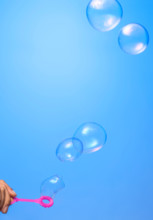 Soap bubbles on blue background
