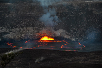 Active lava exploding inside the Halemaumau Crater at night, Kilauea Volcano, Volcanoes National Park, Big Island, Hawaii, USA