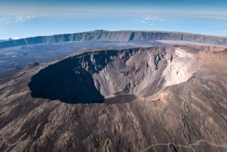 Early morning aerial view of the crater and cone of Piton de la Fournaise, one of the world's most active volcanoes. La Reunion.