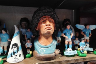 Naples, Italy December 2020: Diego Armando Maradona, the most important Football Player, repeated in the art of Neapolitan nativity of S. Gregorio Armeno.