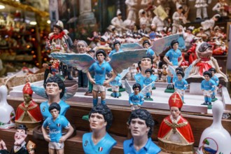 Naples, Italy December 2020: Diego Armando Maradona, the most important Football Player, repeated in the art of Neapolitan nativity of S. Gregorio Armeno.