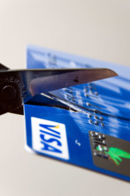 Scissors cutting up bank credit card