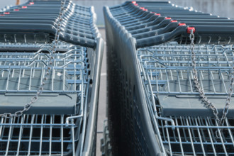 Wire modern supermarket shopping cart, symbol of consumerism in france