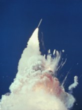 USA - 28 January 1986 - At about 76 seconds, fragments of the Orbiter can be seen tumbling against a background of fire, smoke and vaporized propellan