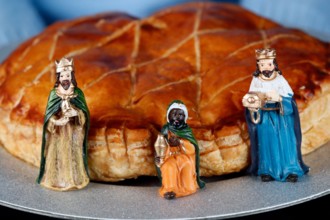 King cake, galette des rois.  Three wise men figurines.  A popular food item available beginning January 6, or Epiphany. France.